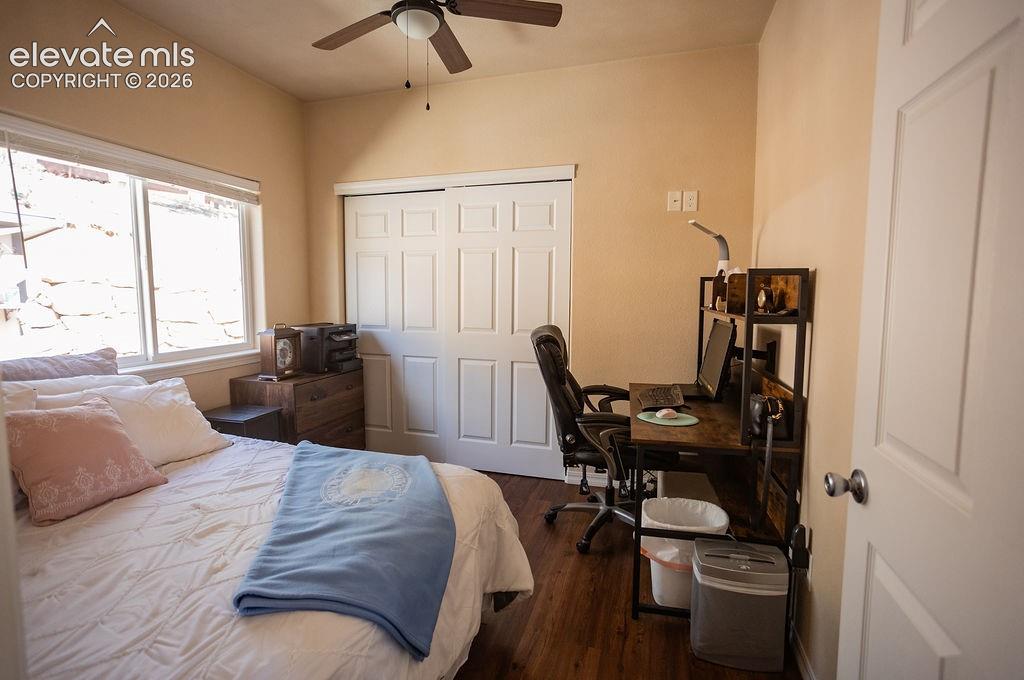 45 Valley Circle Divide, CO 80814 - Photo 14 of 42 a bedroom with a bed and wooden floor