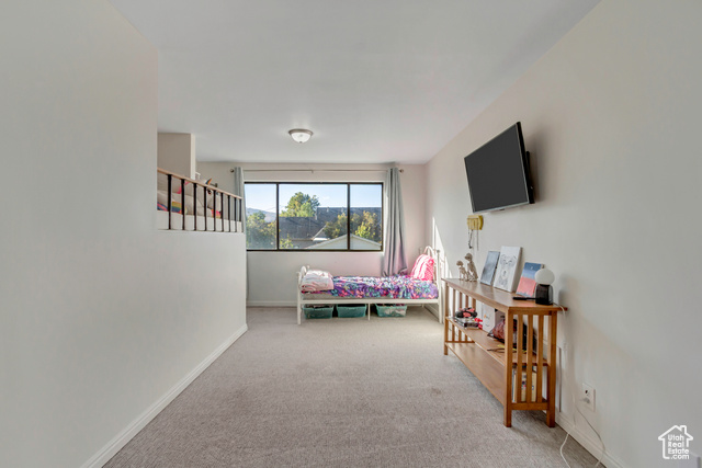 360 East Center Street Centerville, UT 84014 - Photo 24 of 41 Bedroom featuring light carpet and baseboards
