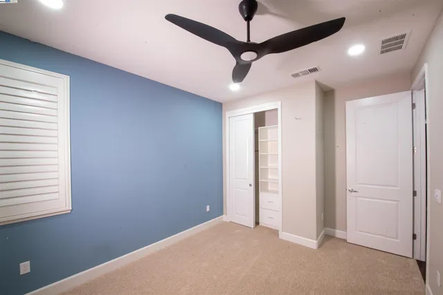 a view of an empty room and a window