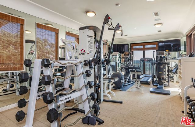 a view of a bathroom with sink and mirror