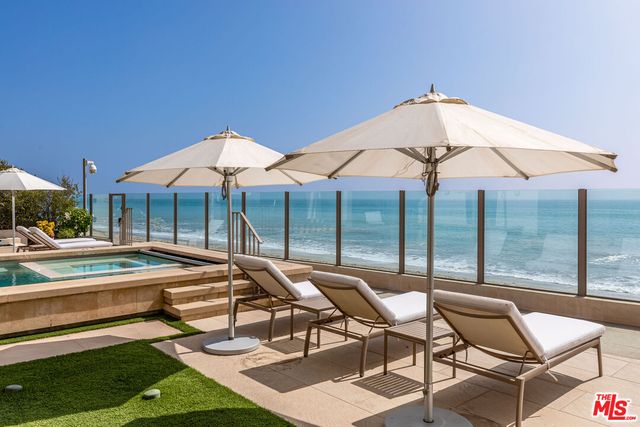 a view of an ocean and a mountain