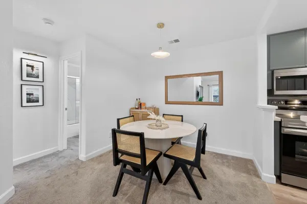 a view of a dining room with furniture