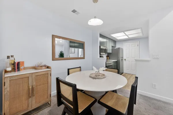 a view of a dining room with furniture