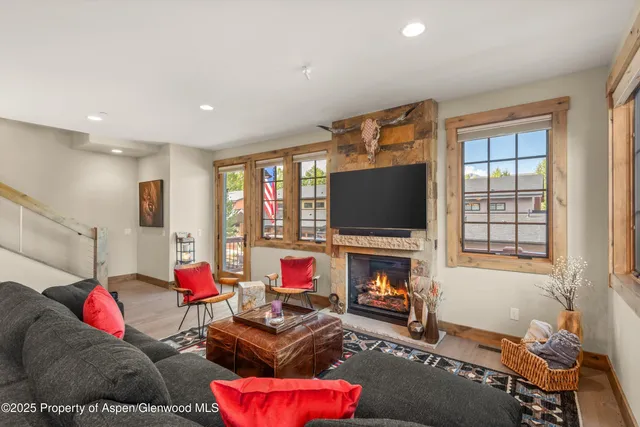 a living room with furniture and a flat screen tv