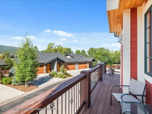 a view of balcony with wooden floor