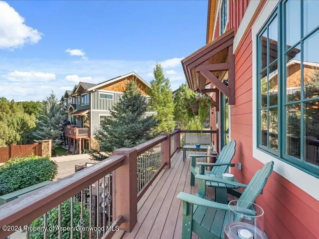 a balcony of an house with outdoor seating