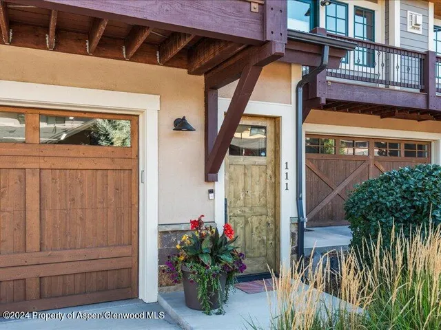 a view of a house with a flower garden