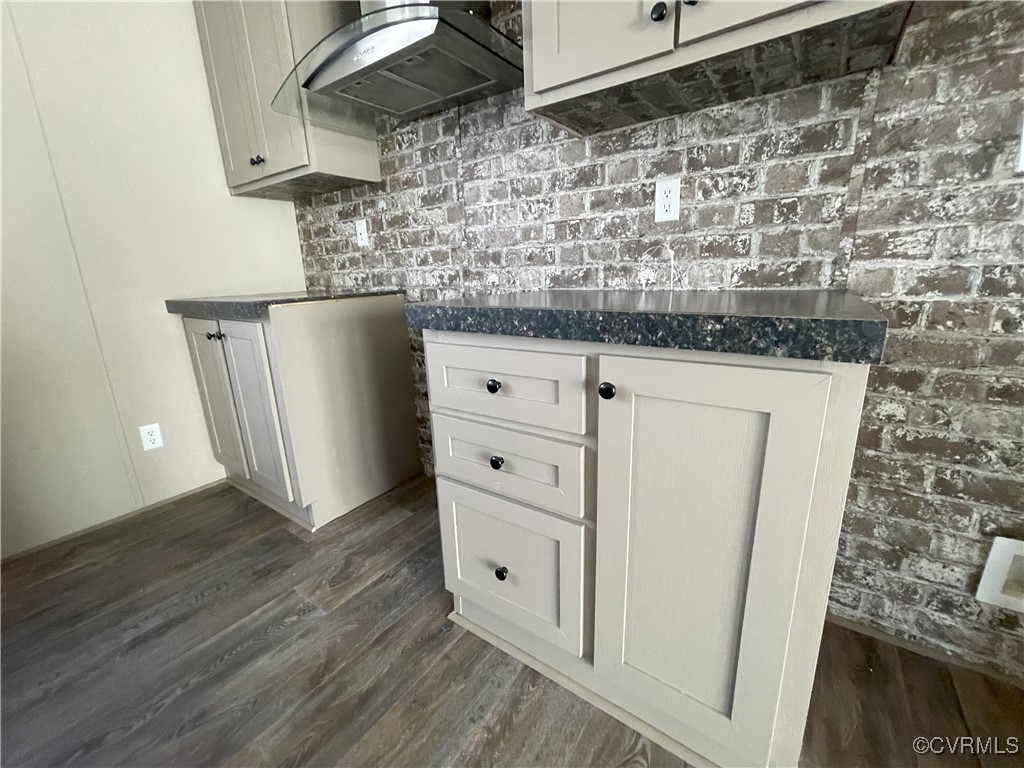 26286 Peters Bridge Road Courtland, VA 23837 - Photo 24 of 32 Kitchen with ventilation hood, dark hardwood / woo