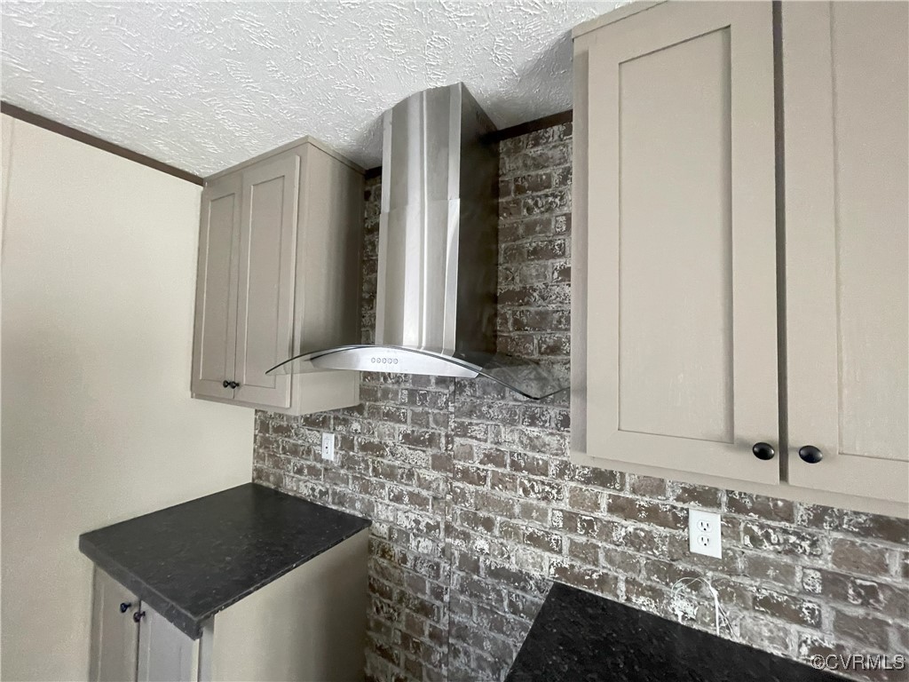 26286 Peters Bridge Road Courtland, VA 23837 - Photo 25 of 32 Kitchen featuring wall chimney exhaust hood, gray