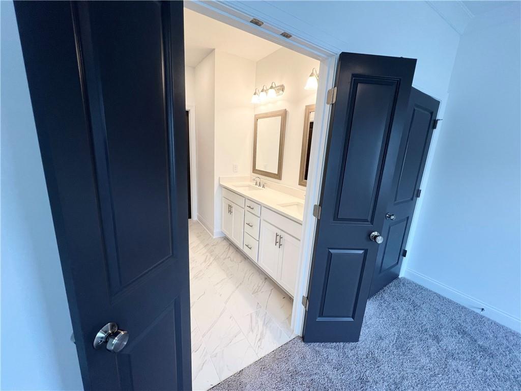 635 Silva Street, Unit 131 Cumming, GA 30040 - Photo 33 of 67 a view of a hallway and a mirror