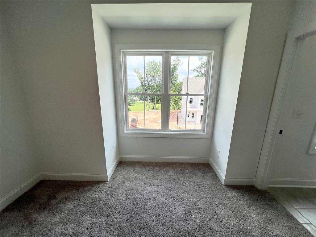 635 Silva Street, Unit 131 Cumming, GA 30040 - Photo 41 of 67 an empty room with a window