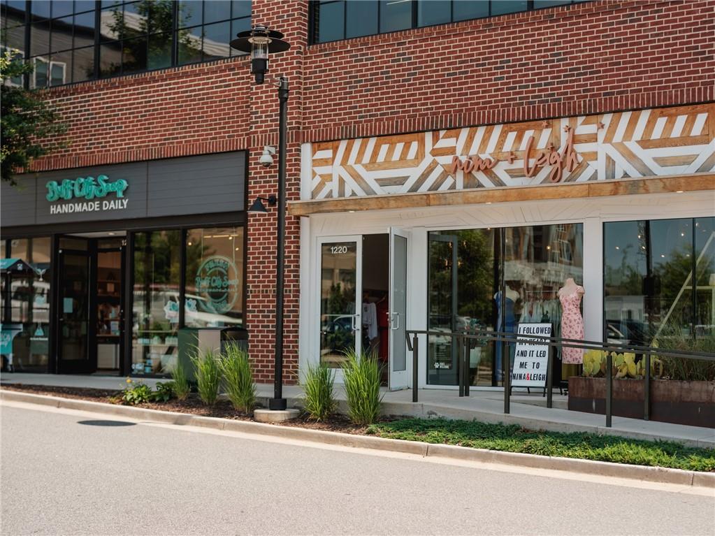 635 Silva Street, Unit 131 Cumming, GA 30040 - Photo 53 of 67 a view of a brick building with a large window
