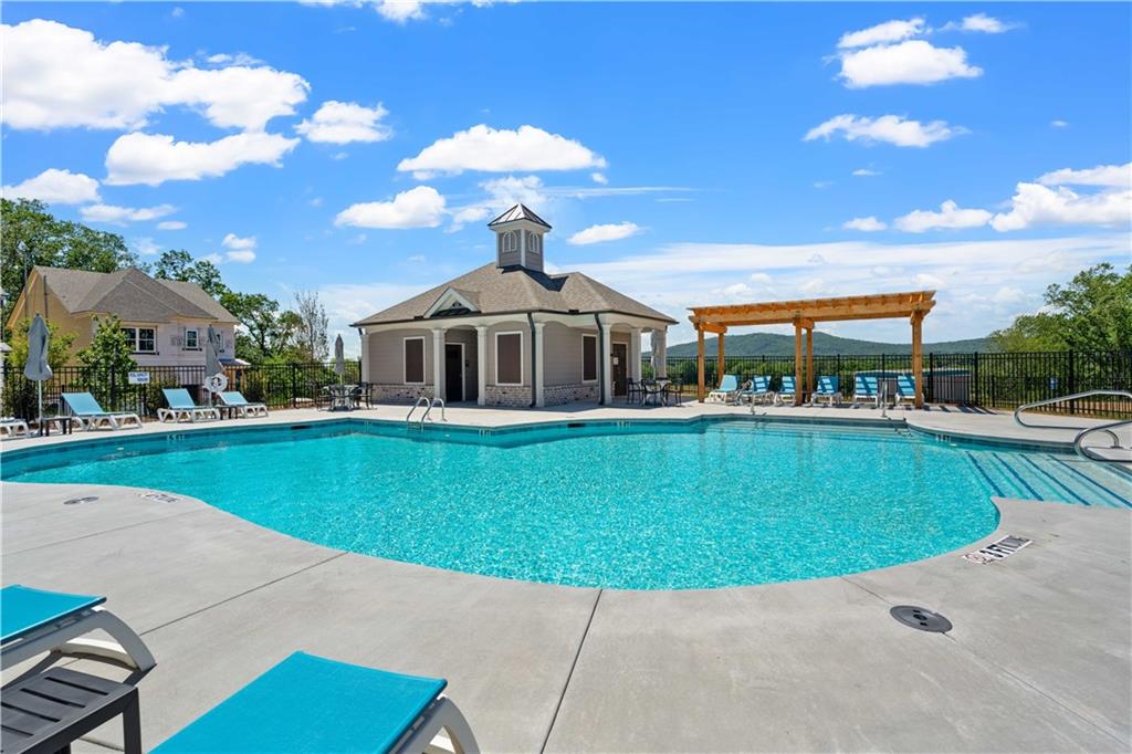 635 Silva Street, Unit 131 Cumming, GA 30040 - Photo 54 of 67 a view of a house with a swimming pool