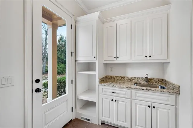 a view of an empty room with a ceiling fan