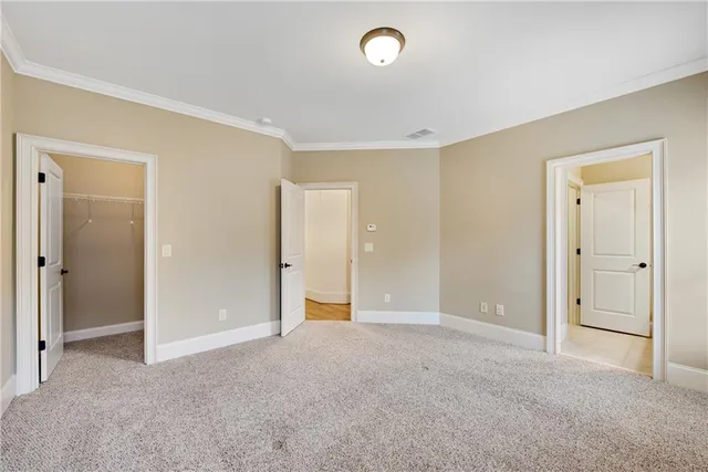 an aerial view of a residential houses with yard