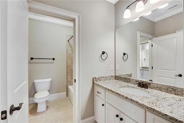 an aerial view of a house with a yard and lake view