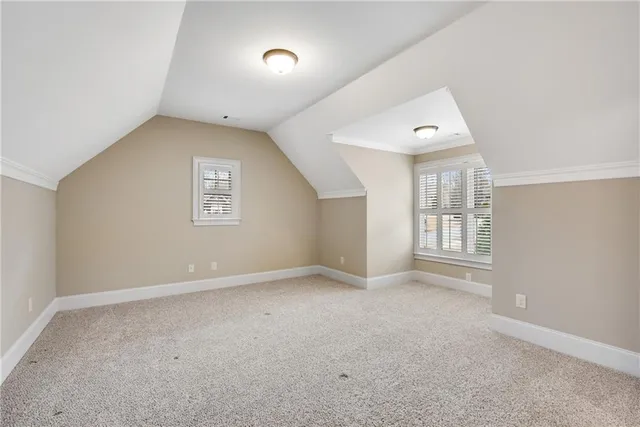 an aerial view of a residential houses with outdoor space and street view