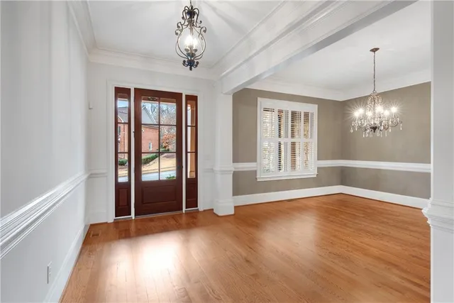 a view of a livingroom with a fireplace and window
