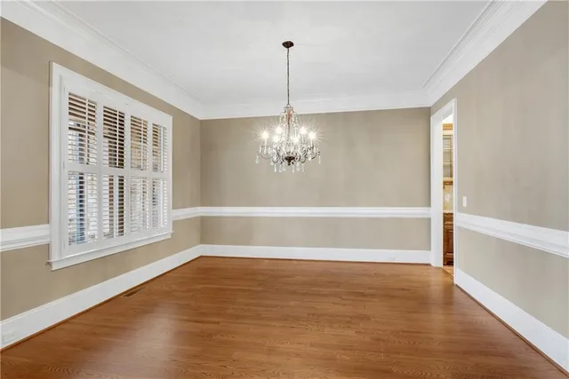 a large kitchen with kitchen island a sink stainless steel appliances and cabinets