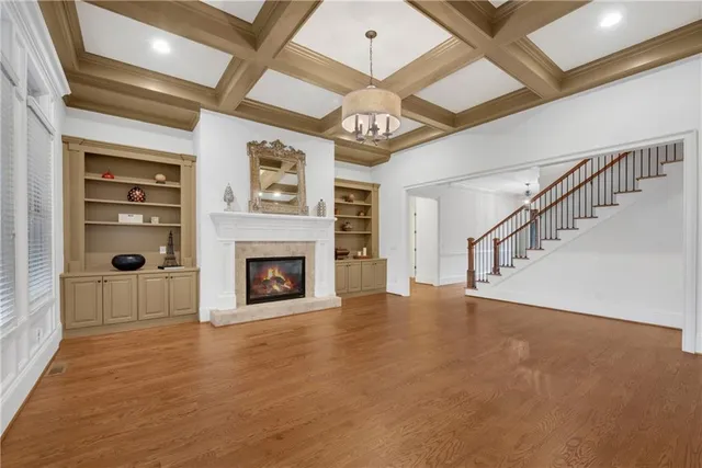 a view of a livingroom with a ceiling fan and window
