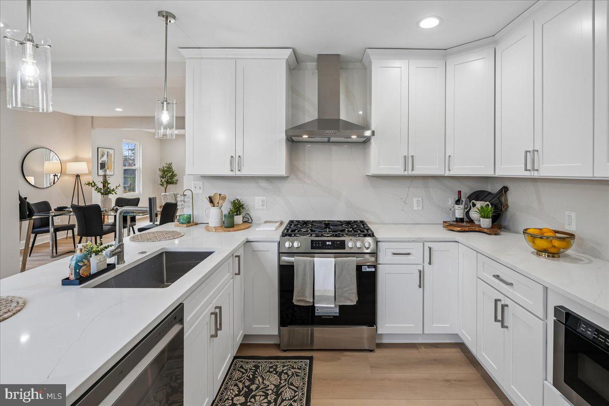 17 Longfellow Street Northwest Washington, DC 20011 - Photo 13 of 41 a kitchen with stainless steel appliances granite countertop a sink and cabinets