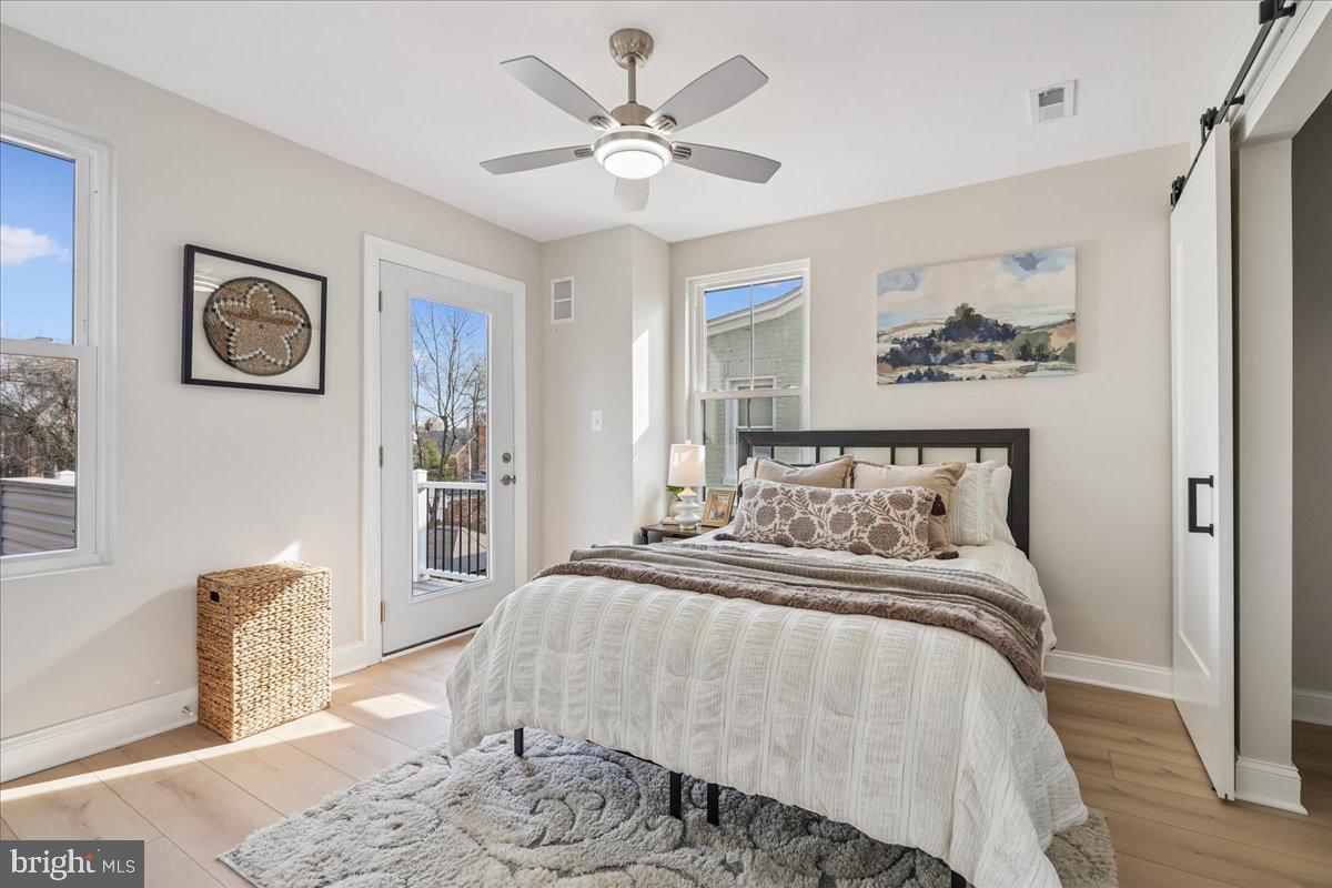 17 Longfellow Street Northwest Washington, DC 20011 - Photo 16 of 41 a bedroom with bed and a chandelier