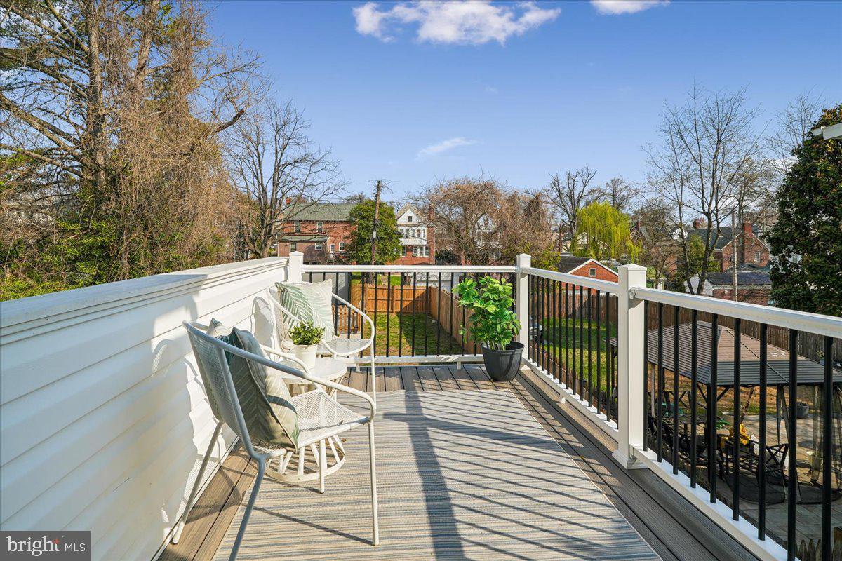 17 Longfellow Street Northwest Washington, DC 20011 - Photo 20 of 41 a view of a chair and tables on the balcony