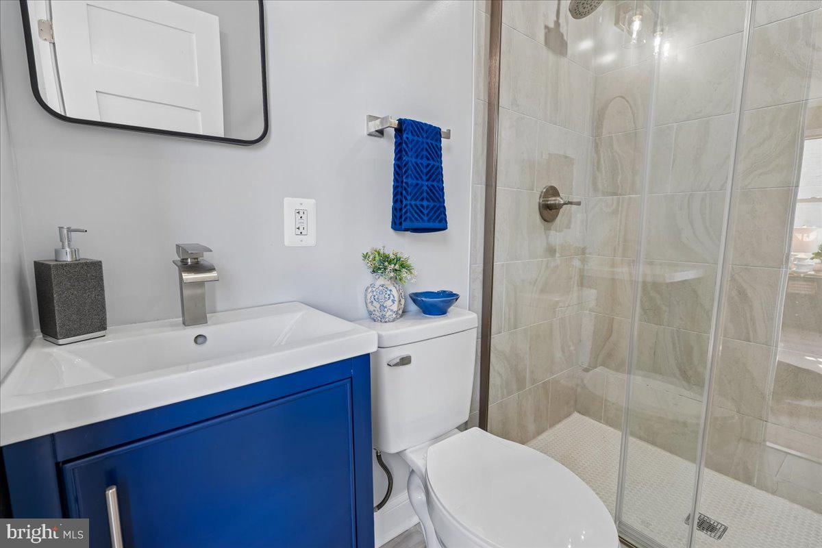 17 Longfellow Street Northwest Washington, DC 20011 - Photo 22 of 41 a bathroom with a sink a toilet and shower