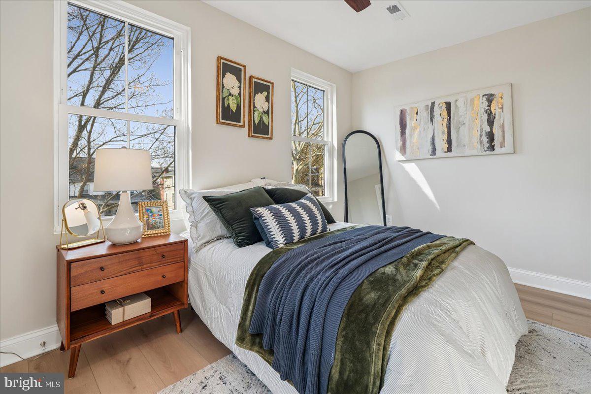 17 Longfellow Street Northwest Washington, DC 20011 - Photo 28 of 41 a bedroom with bed and a painting on the wall