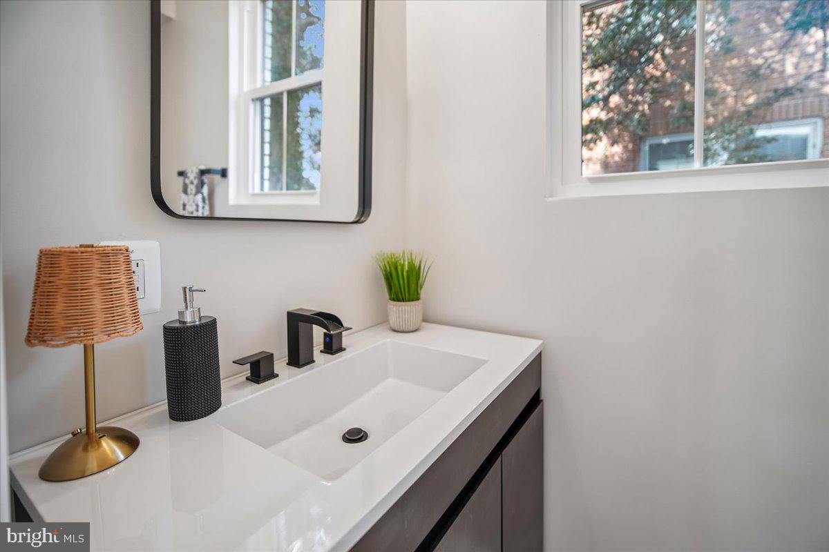 17 Longfellow Street Northwest Washington, DC 20011 - Photo 30 of 41 a bathroom with a sink and a mirror
