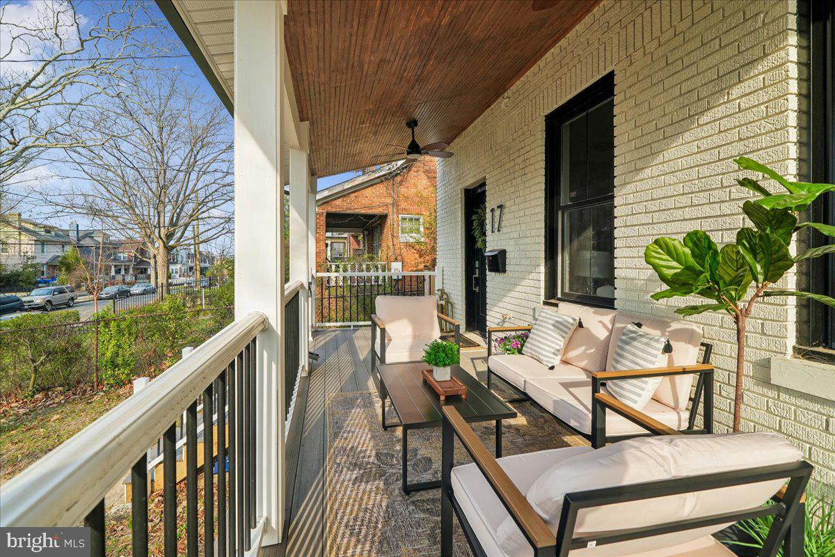 17 Longfellow Street Northwest Washington, DC 20011 - Photo 3 of 41 a view of deck with furniture and trees around