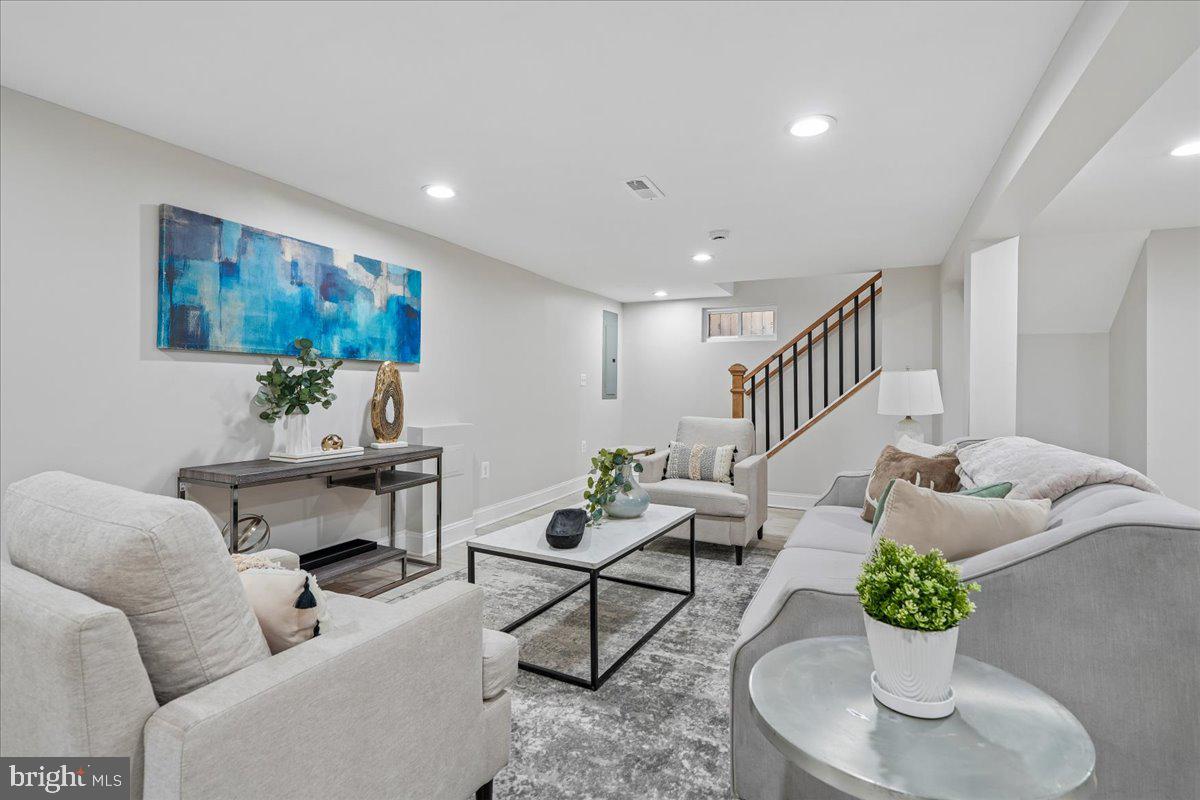 17 Longfellow Street Northwest Washington, DC 20011 - Photo 32 of 41 a living room with furniture potted plant and a lamp