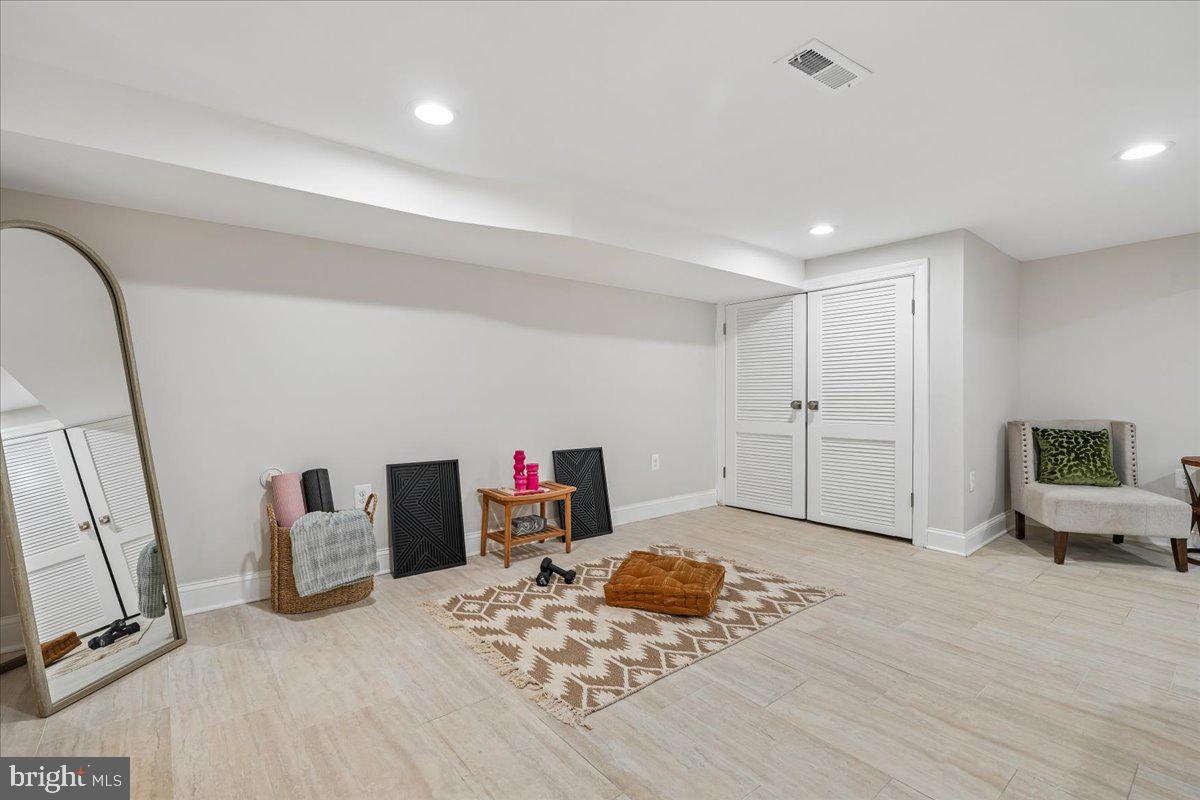 17 Longfellow Street Northwest Washington, DC 20011 - Photo 33 of 41 a bedroom with furniture and a wooden floor