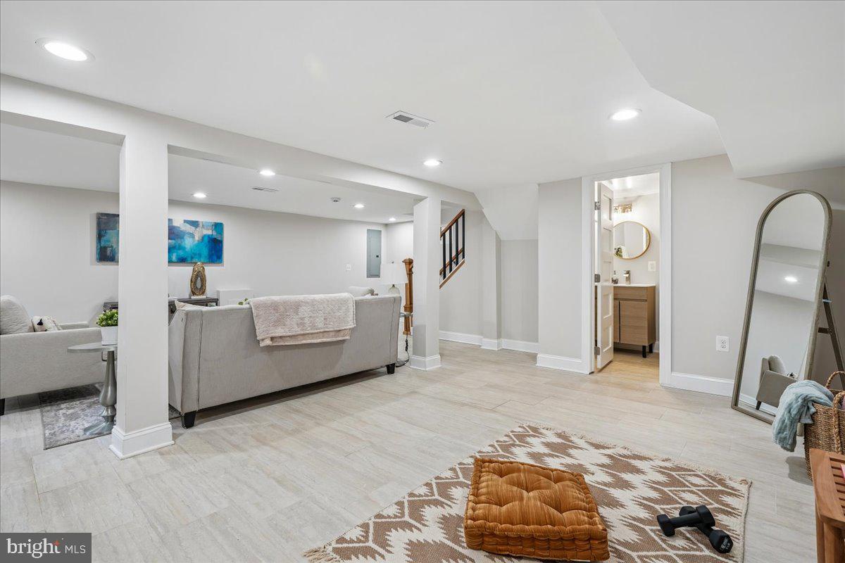 17 Longfellow Street Northwest Washington, DC 20011 - Photo 34 of 41 a living room with furniture and a wooden floor