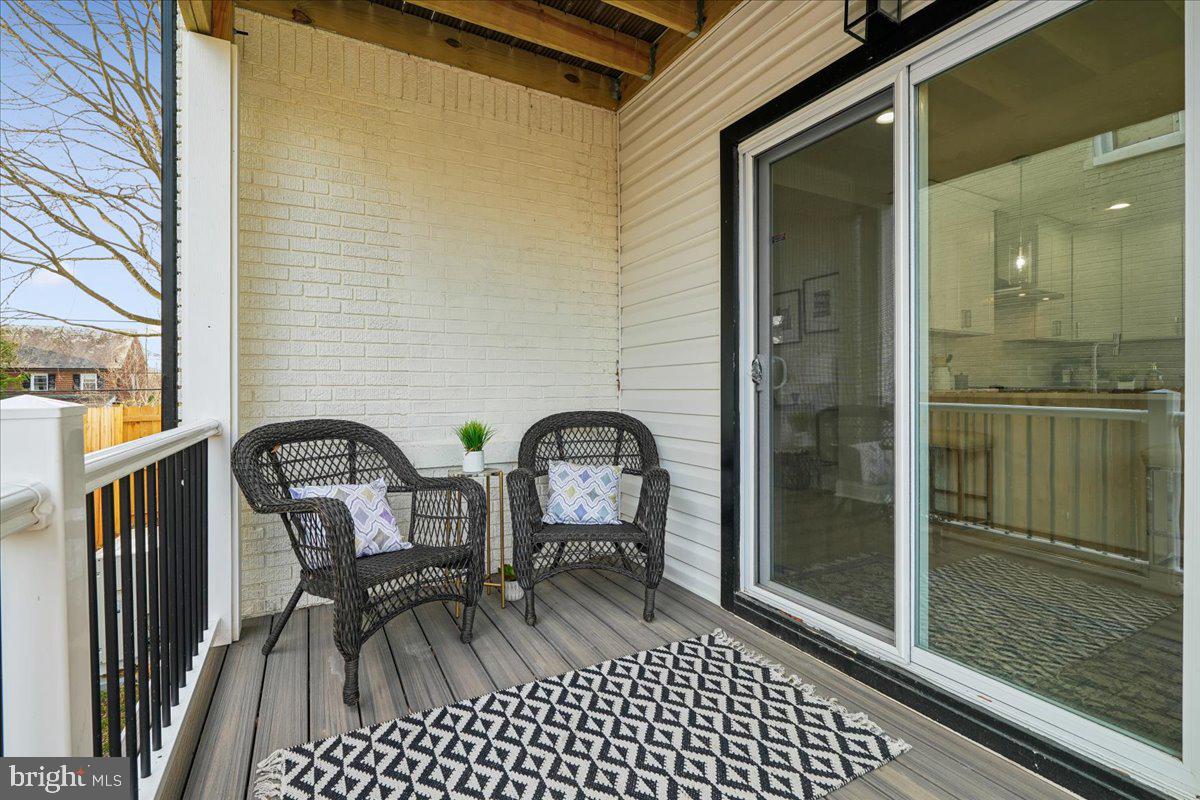 17 Longfellow Street Northwest Washington, DC 20011 - Photo 35 of 41 a couple of chairs sitting in front of a door