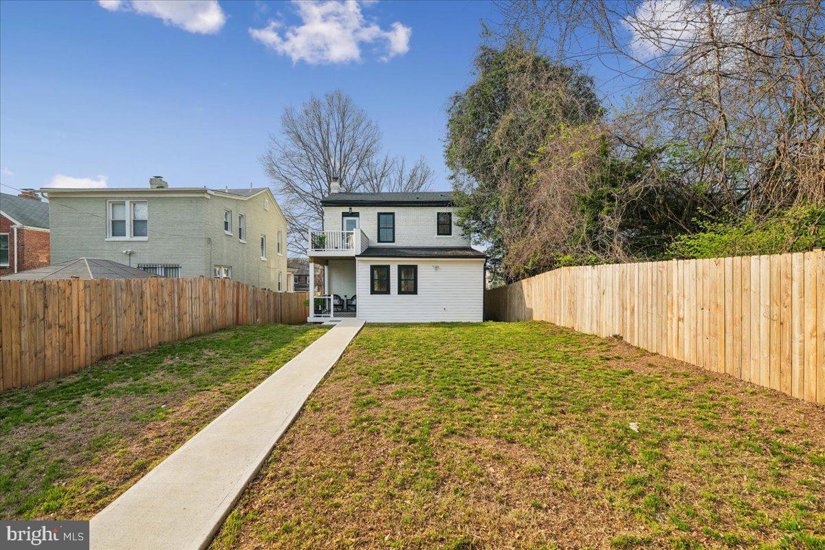 17 Longfellow Street Northwest Washington, DC 20011 - Photo 37 of 41 a front view of a house with a yard