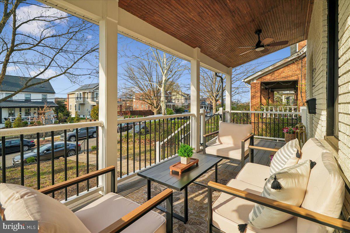 17 Longfellow Street Northwest Washington, DC 20011 - Photo 5 of 41 a living room with furniture and a floor to ceiling window