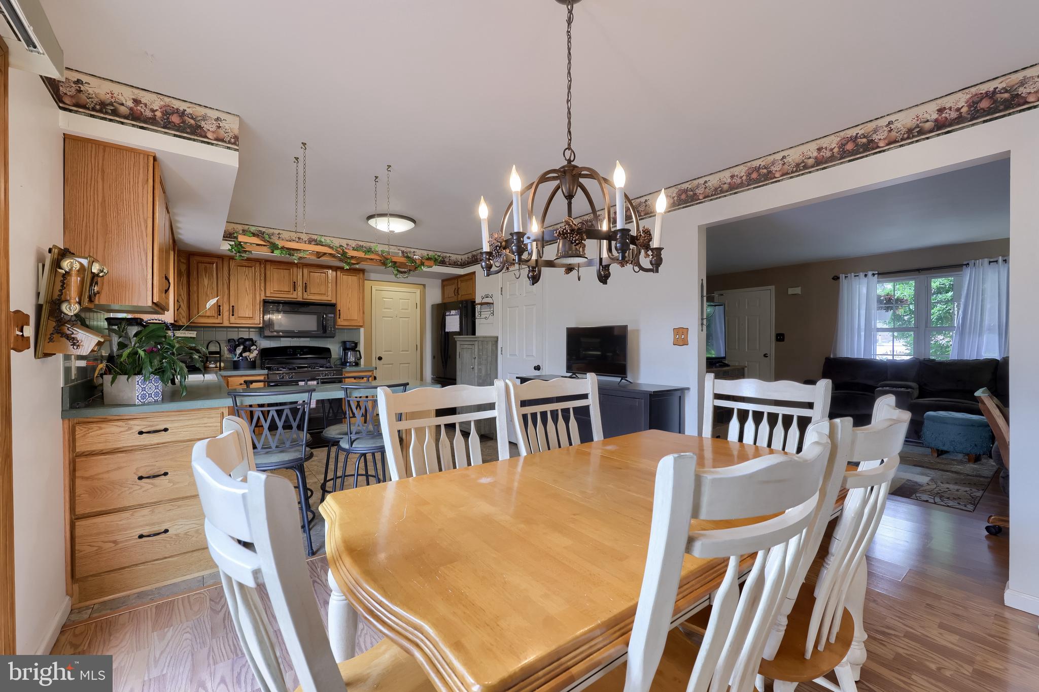 105 Bainbridge Circle Reading, PA 19608 - Photo 12 of 36 a view of a dining room with furniture and wooden floor
