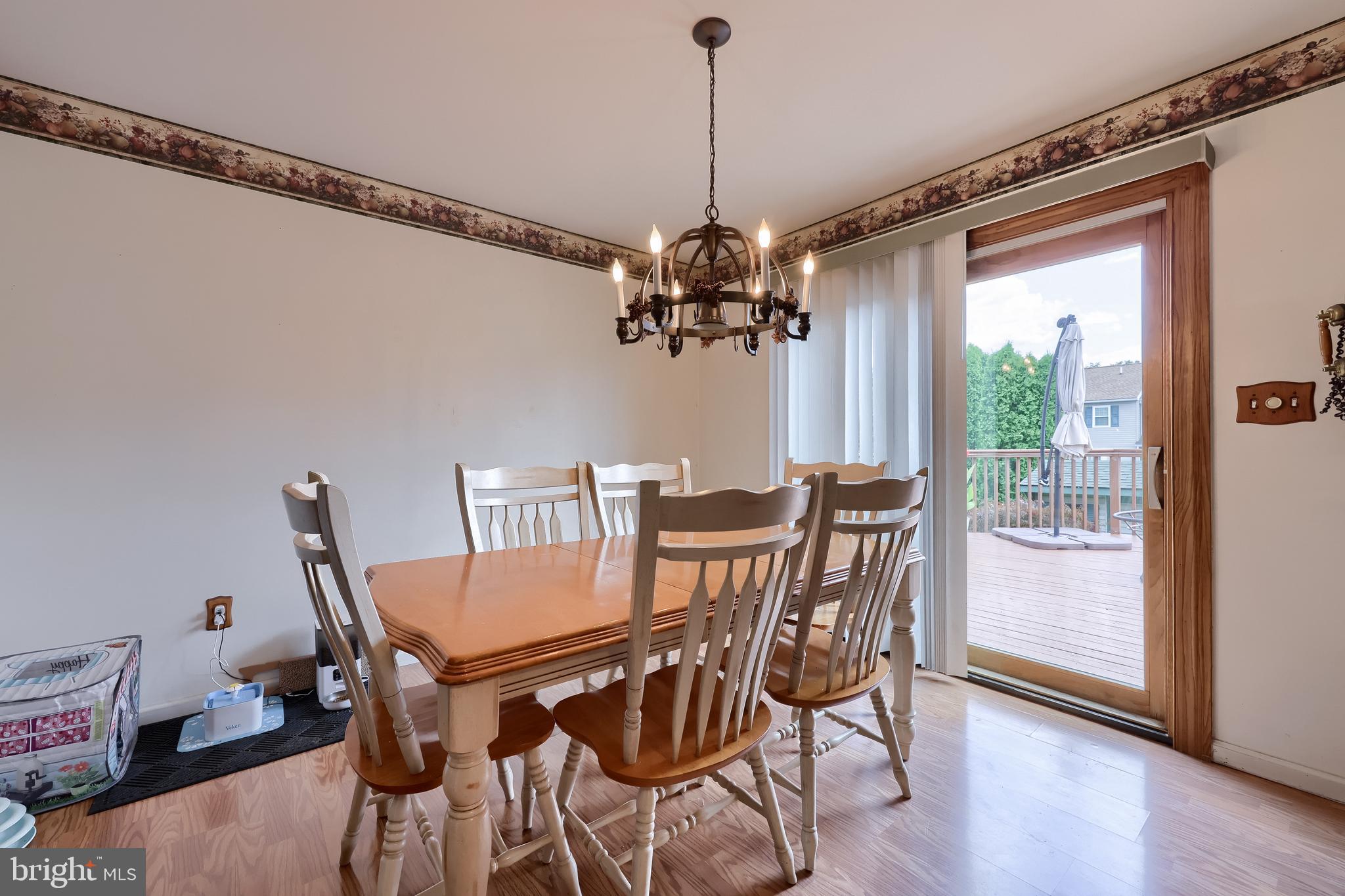 105 Bainbridge Circle Reading, PA 19608 - Photo 17 of 36 a view of a dining room with furniture window and wooden floor
