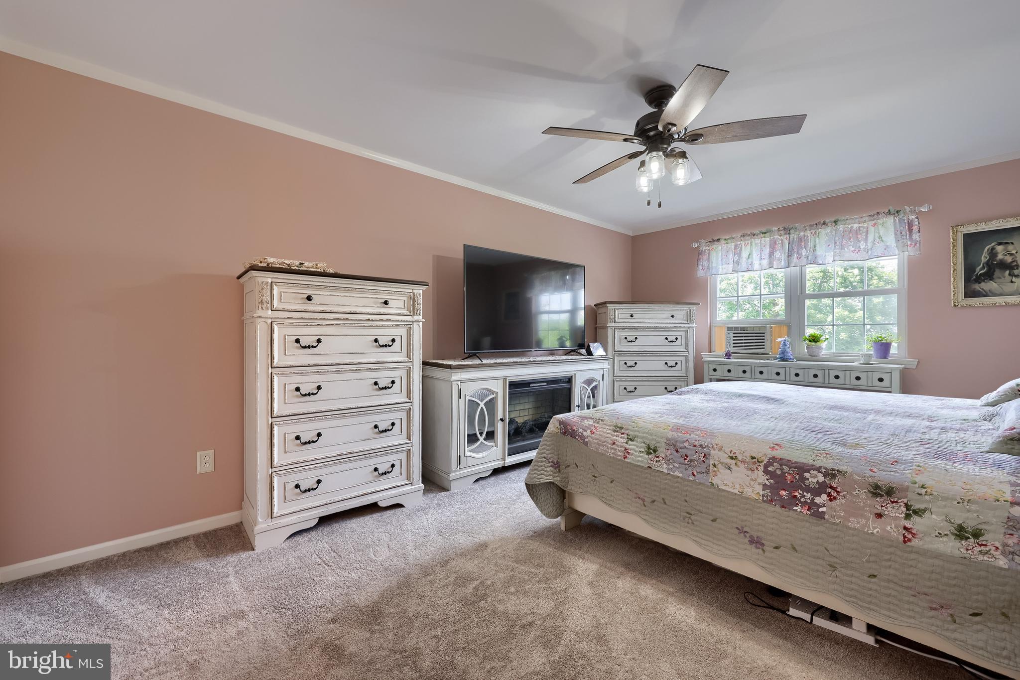 105 Bainbridge Circle Reading, PA 19608 - Photo 21 of 36 a bedroom with a bed a large mirror and a flat tv screen on dresser