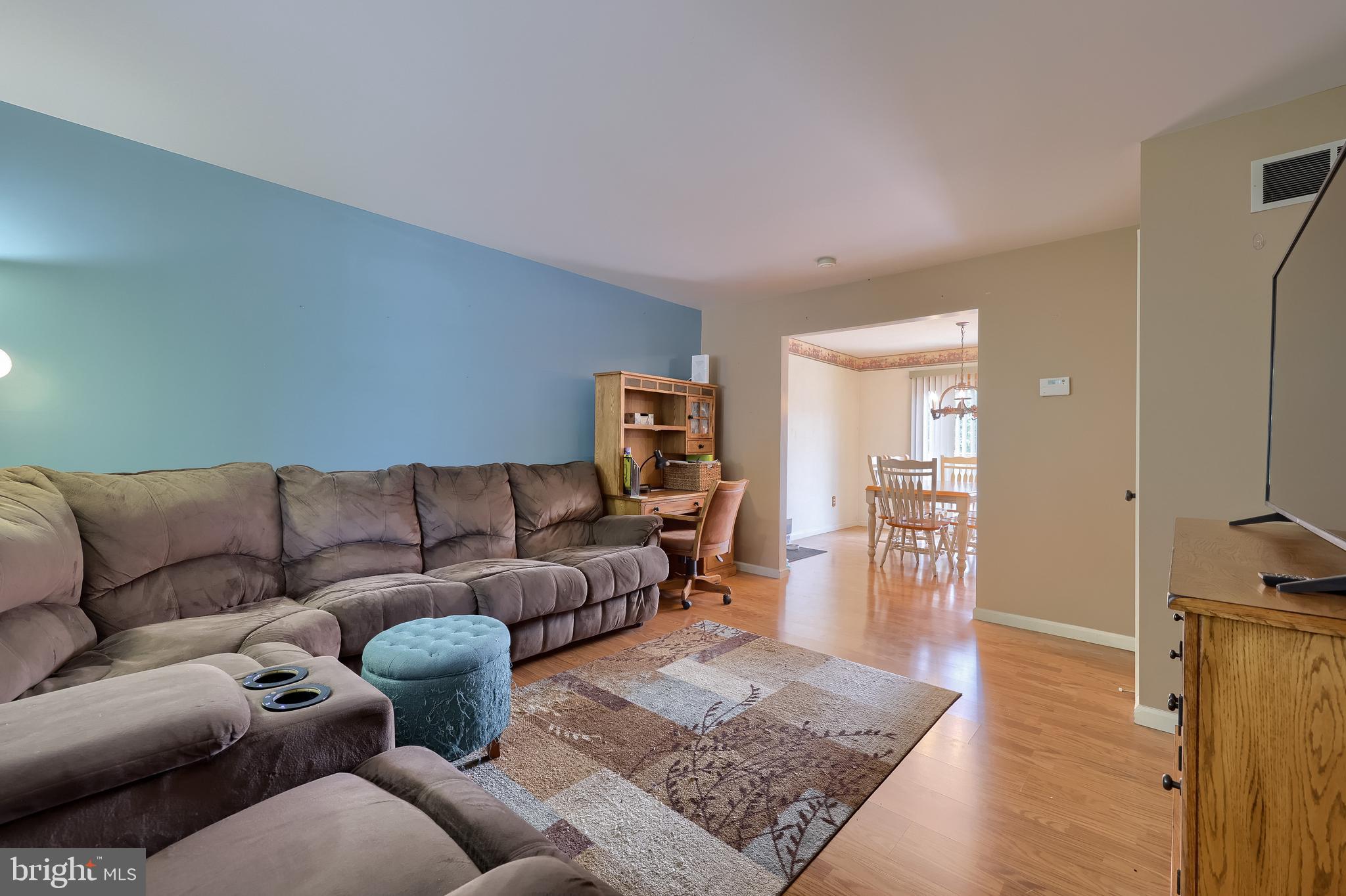 105 Bainbridge Circle Reading, PA 19608 - Photo 6 of 36 a living room with furniture and a wooden floor