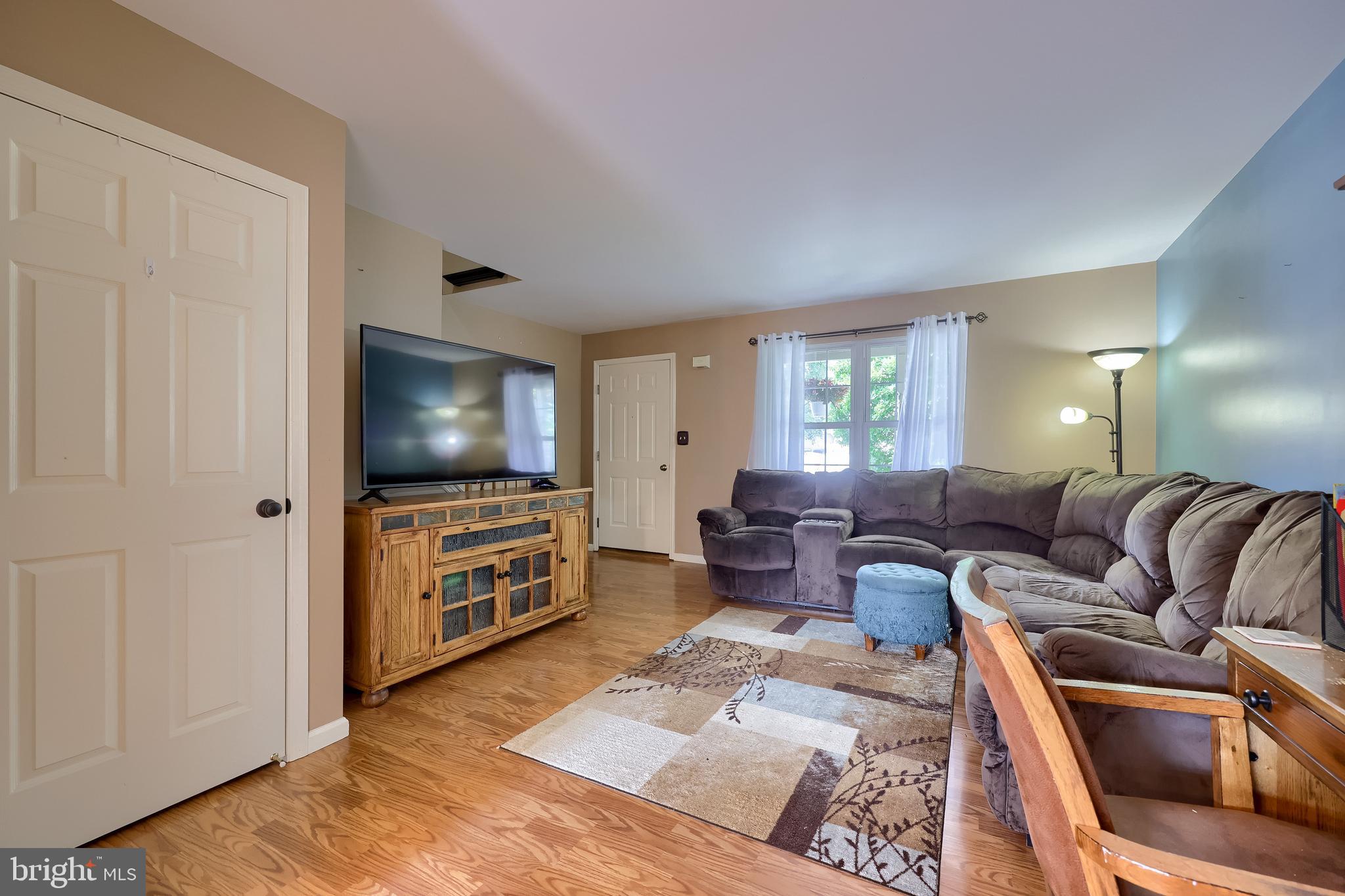 105 Bainbridge Circle Reading, PA 19608 - Photo 7 of 36 a living room with furniture and a flat screen tv