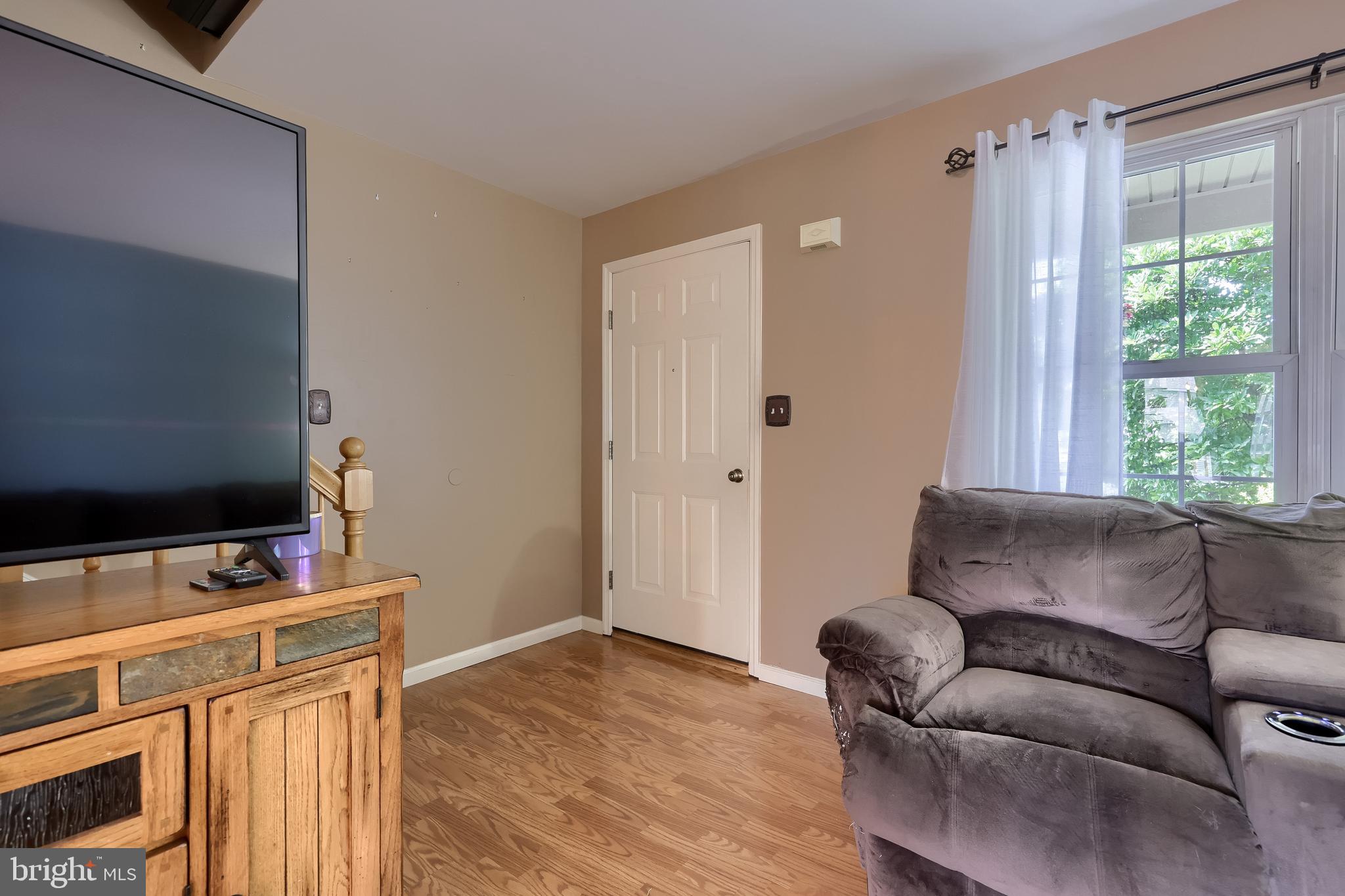 105 Bainbridge Circle Reading, PA 19608 - Photo 9 of 36 a living room with furniture and a flat screen tv