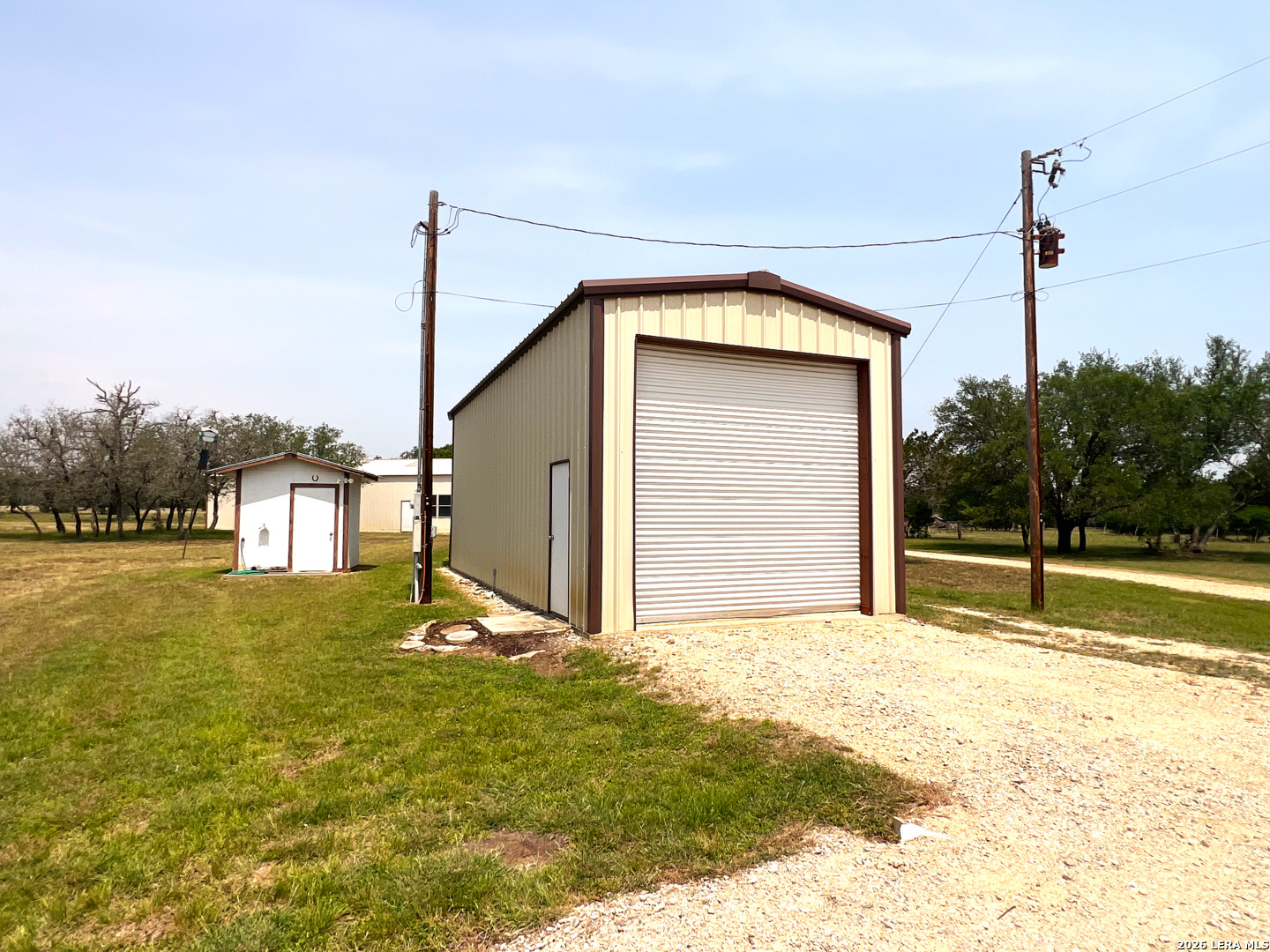 1220 Flying T Ranch Road Bandera, TX 78003 - Photo 16 of 27 a view of a house with a yard