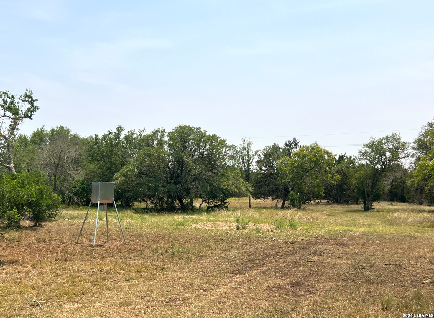 1220 Flying T Ranch Road Bandera, TX 78003 - Photo 20 of 27 a view of a lake with a yard