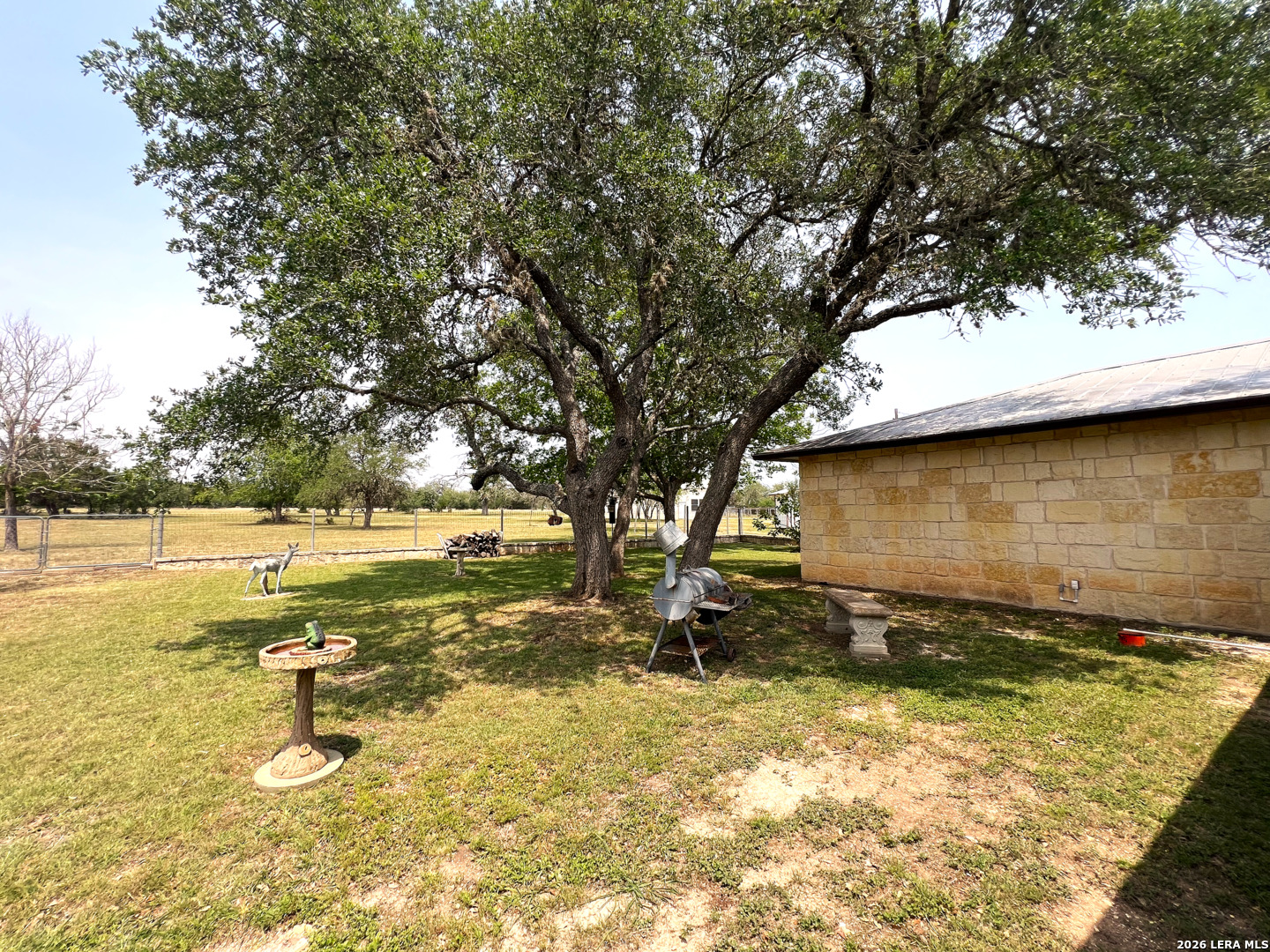 1220 Flying T Ranch Road Bandera, TX 78003 - Photo 27 of 27 a view of a yard with swimming pool