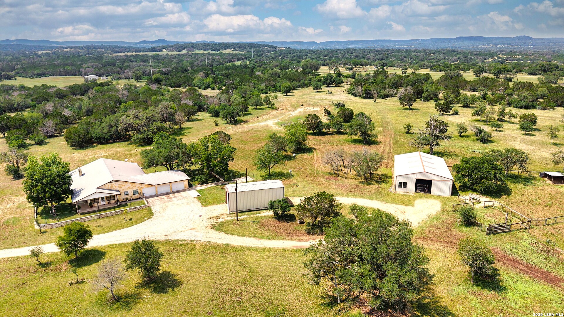1220 Flying T Ranch Road Bandera, TX 78003 - Photo 3 of 27 an aerial view of residential houses with outdoor space