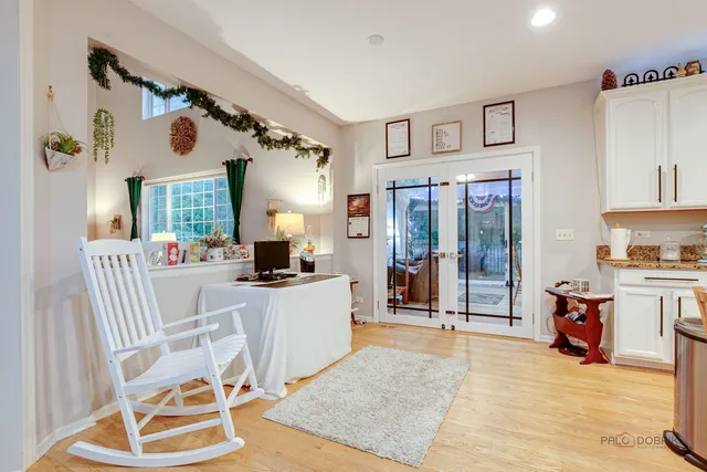 a living room with furniture a rug and white walls