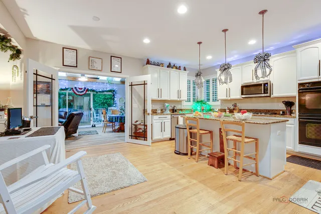a kitchen with counter top space cabinets and stainless steel appliances