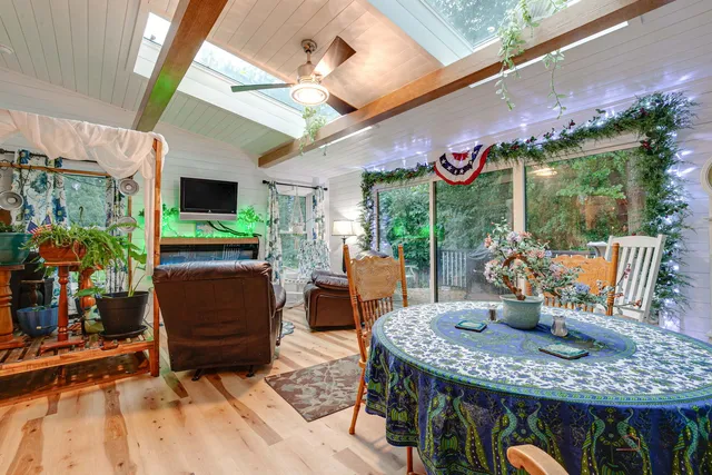 a outdoor dining space with furniture and garden view